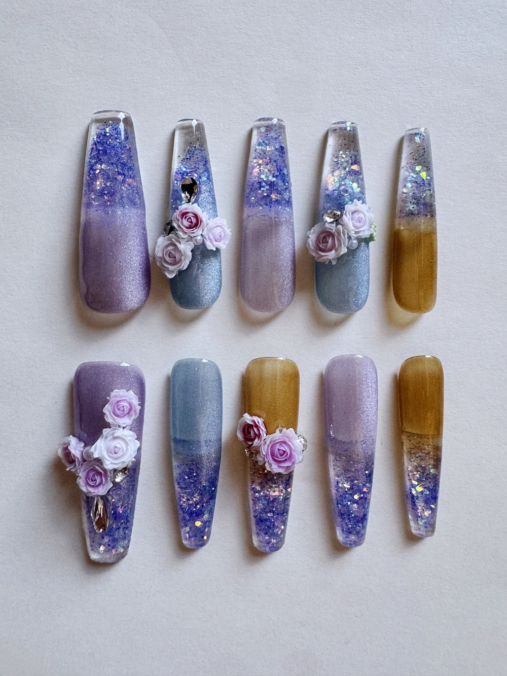 Hand Drawn Elaborate Cool Purple Glittering Cat Eye Flowing Sand Nail Art